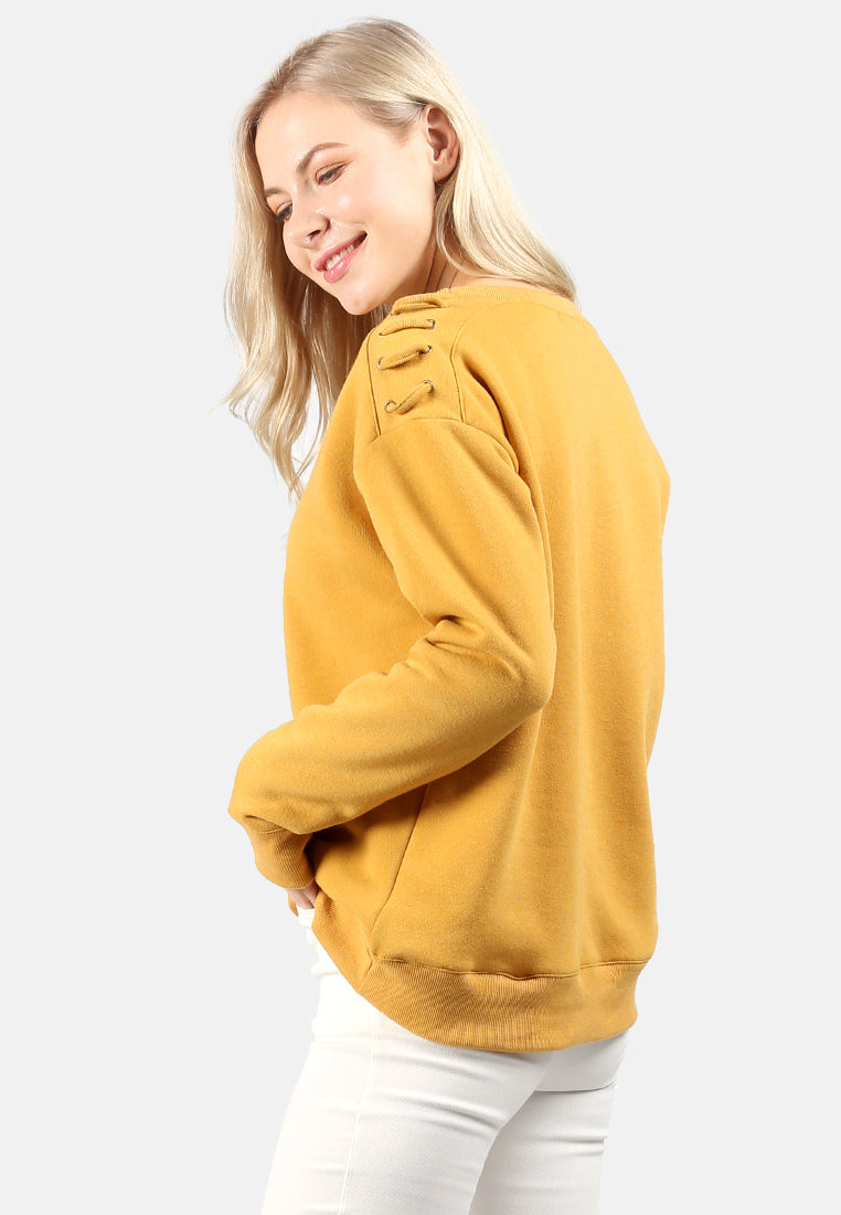sweatshirt with shoulder lace loop#color_mustard