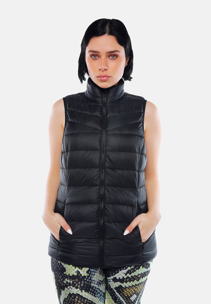 sleeveless puffer jacket in tangerine#color_black