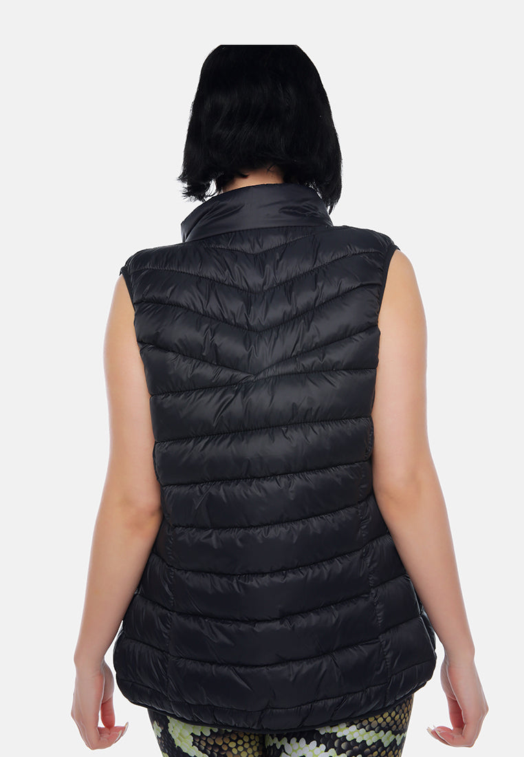 sleeveless puffer jacket in tangerine#color_black