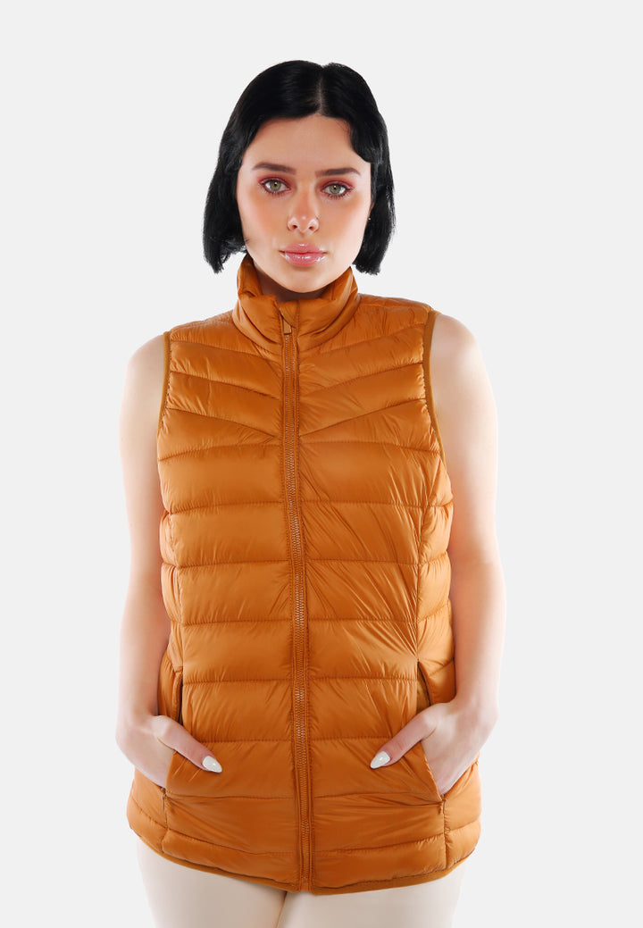 sleeveless puffer jacket in tangerine#color_mustard
