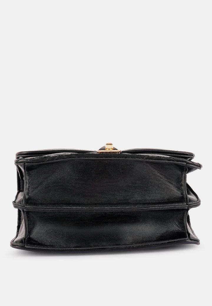quilted multi metal strap handbag#color_black