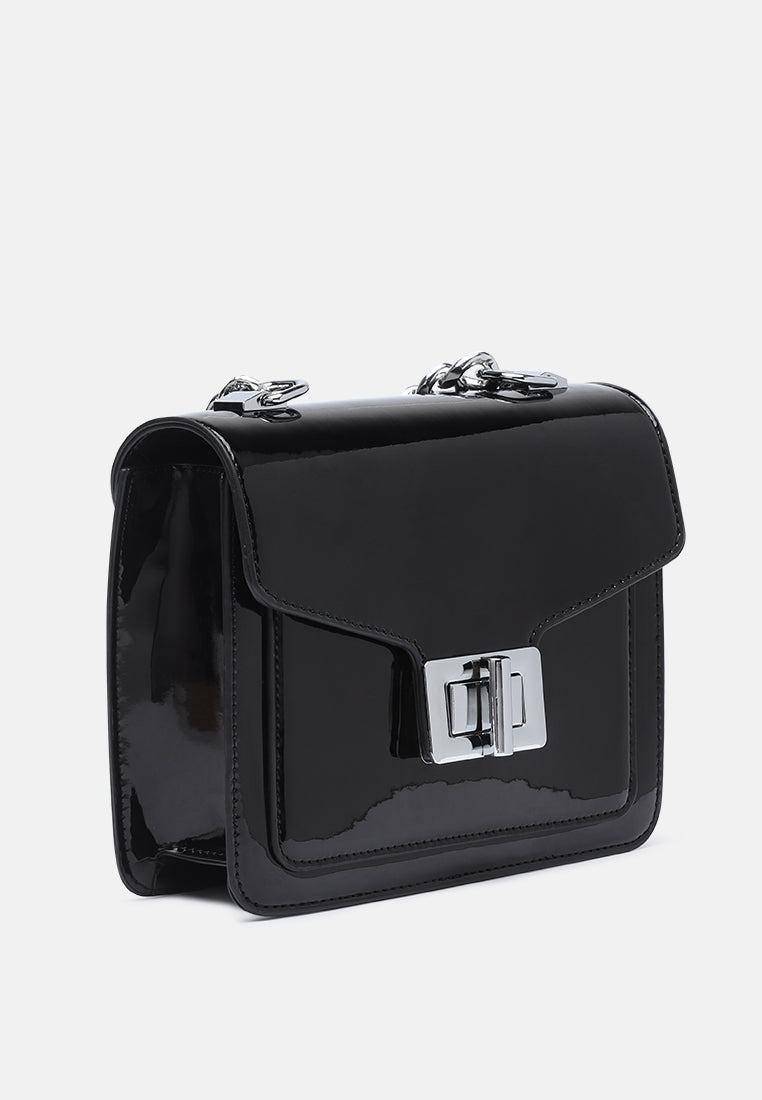 classic sling bag with twist and lock closure#color_black