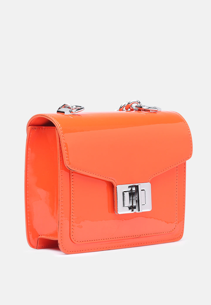 classic sling bag with twist and lock closure#color_orange
