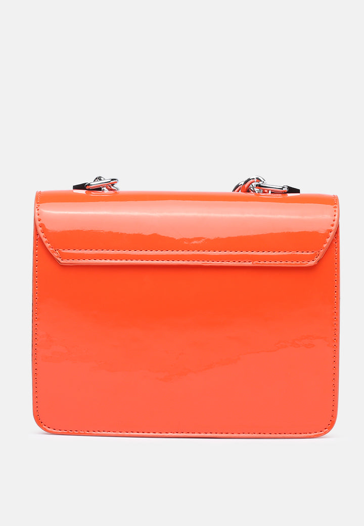 classic sling bag with twist and lock closure#color_orange