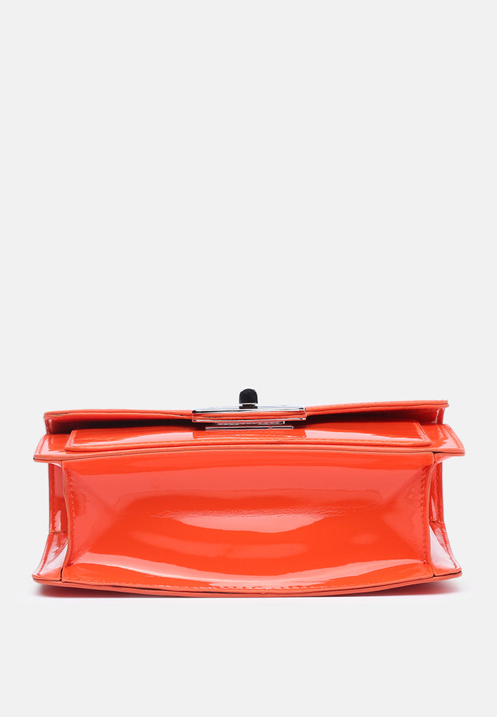 classic sling bag with twist and lock closure#color_orange