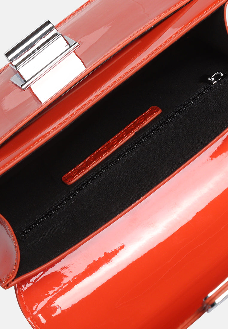 classic sling bag with twist and lock closure#color_orange