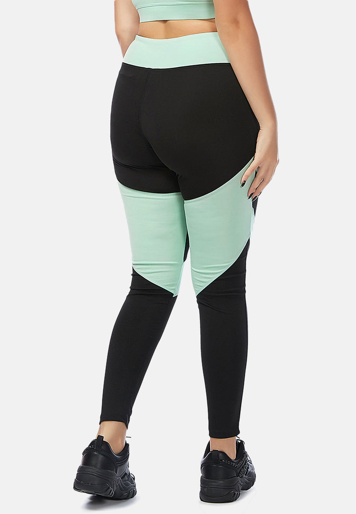 geometric paneled mesh yoga leggings#color_black-sea-salt-green