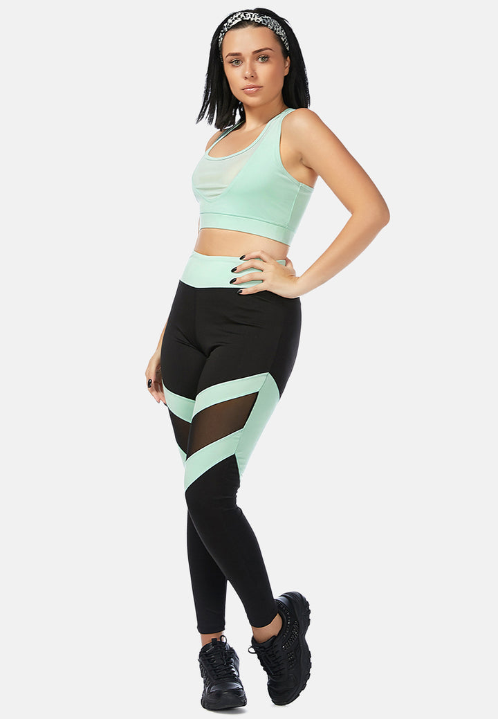 geometric paneled mesh yoga leggings#color_black-sea-salt-green