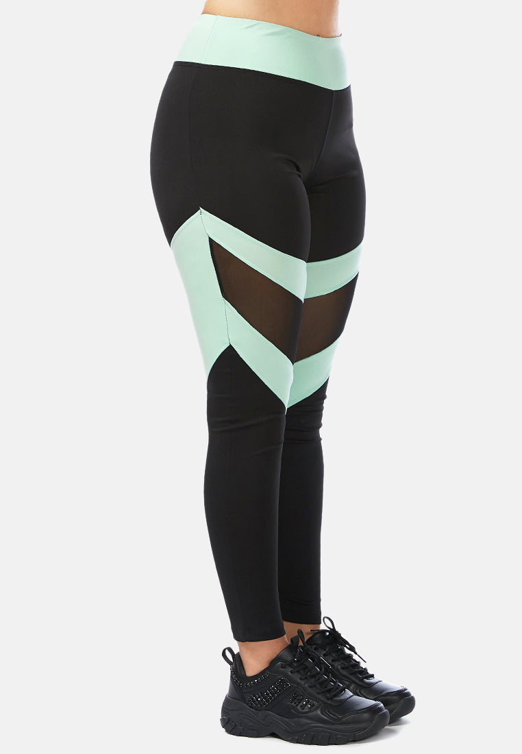 geometric paneled mesh yoga leggings#color_black-sea-salt-green