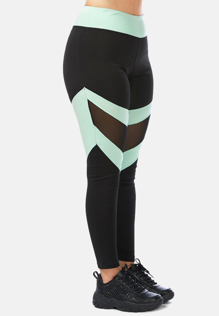 geometric paneled mesh yoga leggings#color_black-sea-salt-green