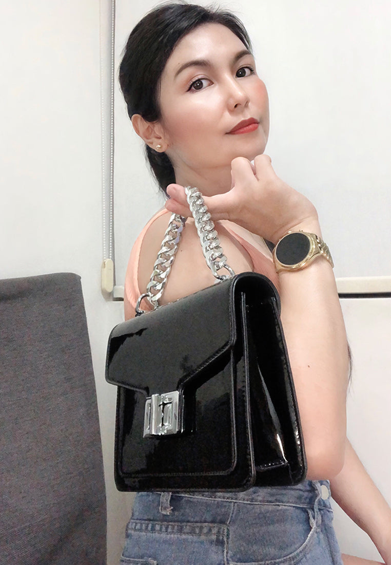 classic sling bag with twist and lock closure#color_black